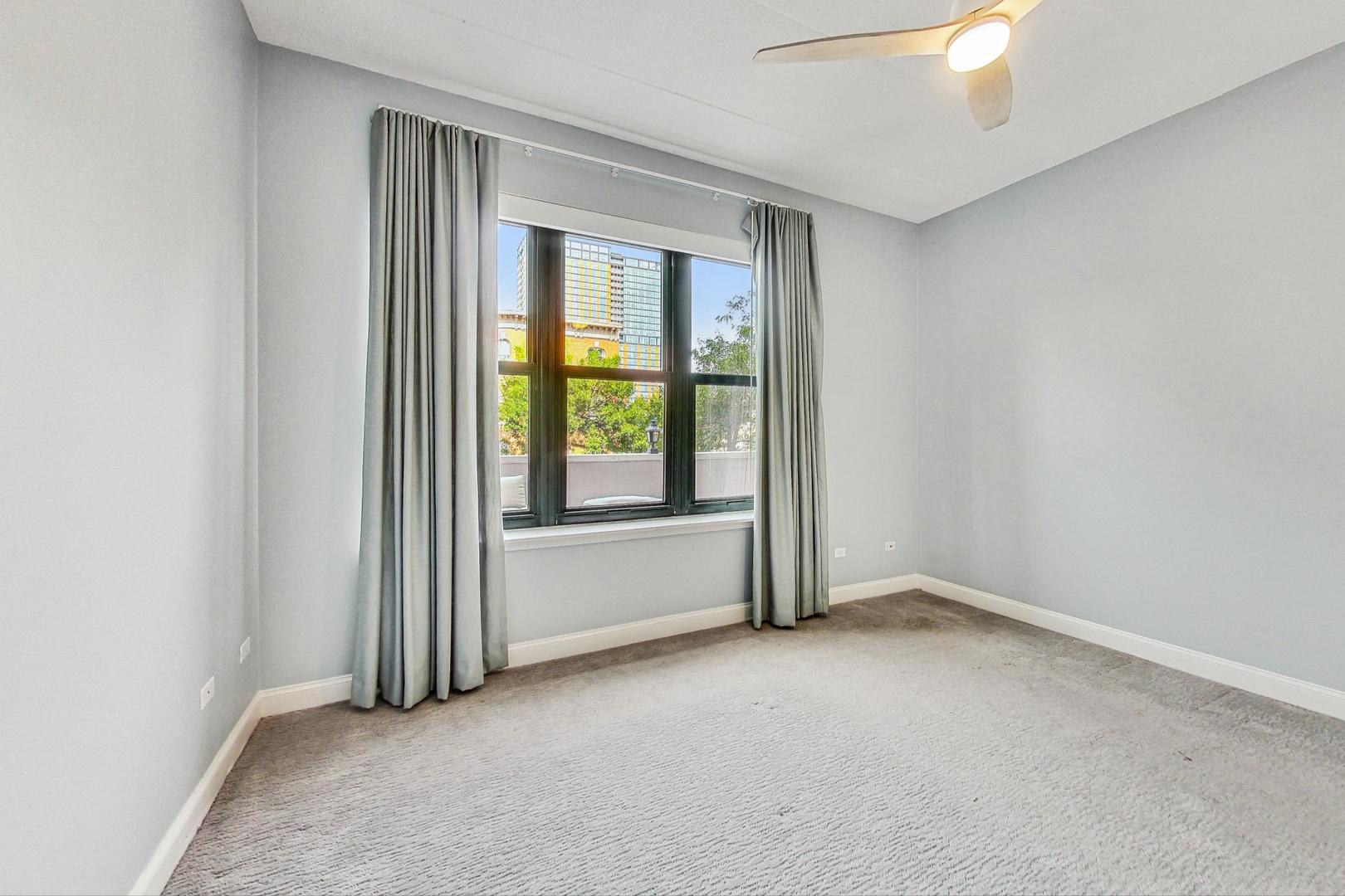 1301 West Washington Boulevard, Unit 208 Chicago, IL 60607 - Photo 16 of 37 an empty room with windows