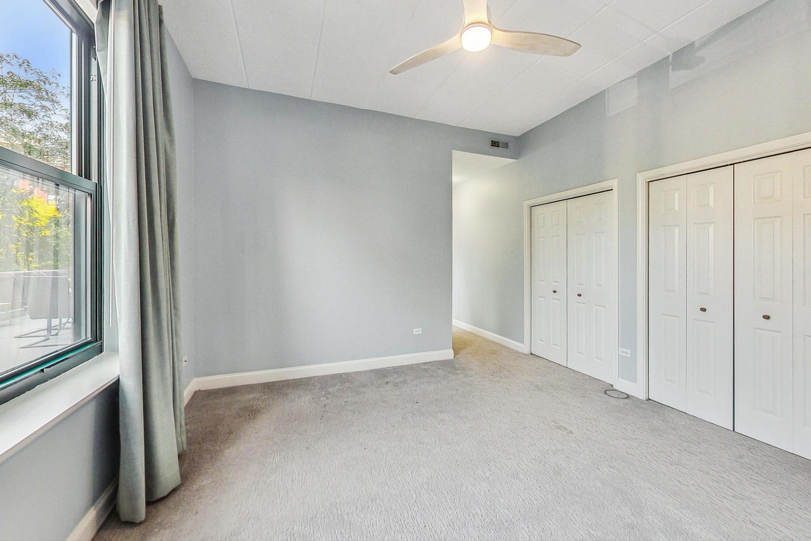 1301 West Washington Boulevard, Unit 208 Chicago, IL 60607 - Photo 17 of 37 a view of an empty room and a window