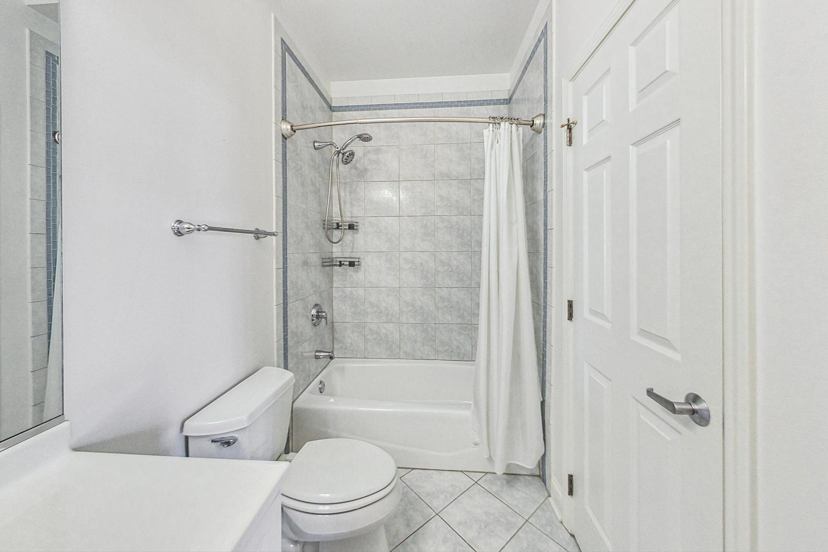 1301 West Washington Boulevard, Unit 208 Chicago, IL 60607 - Photo 26 of 37 a bathroom with a toilet and a shower