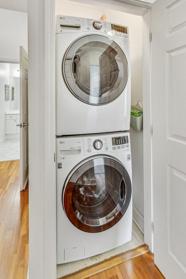 1301 West Washington Boulevard, Unit 208 Chicago, IL 60607 - Photo 27 of 37 a utility room with dryer and washer