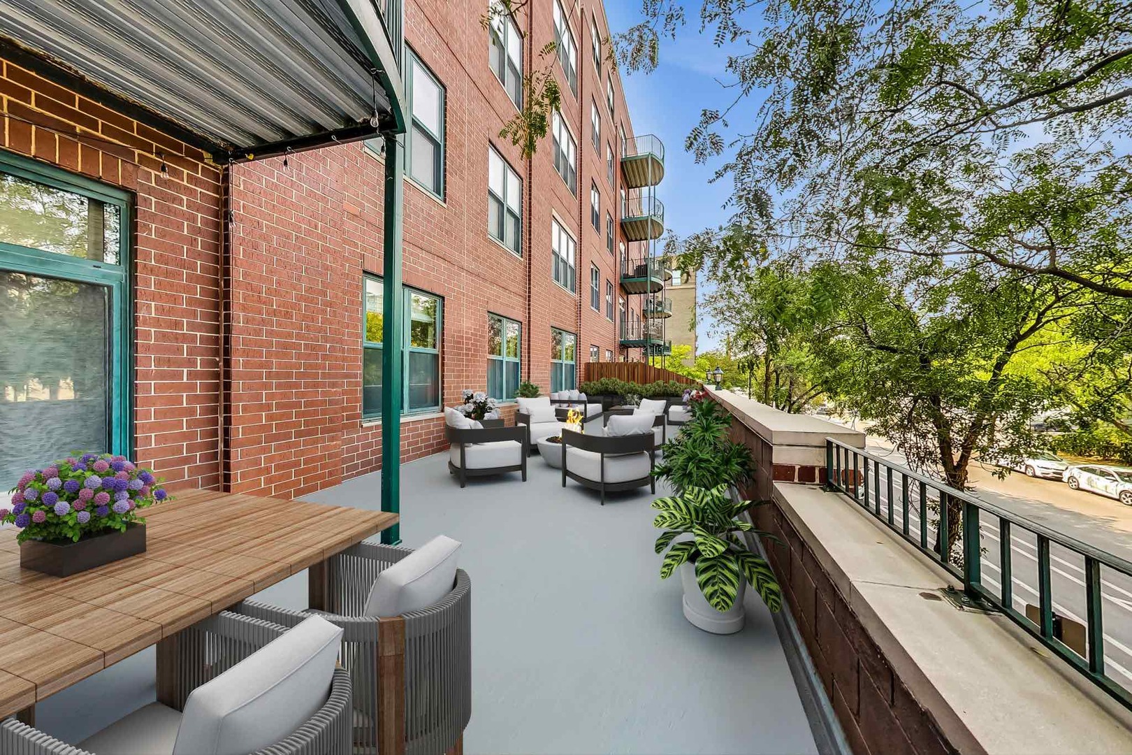 1301 West Washington Boulevard, Unit 208 Chicago, IL 60607 - Photo 32 of 37 a view of balcony with couch and potted plant