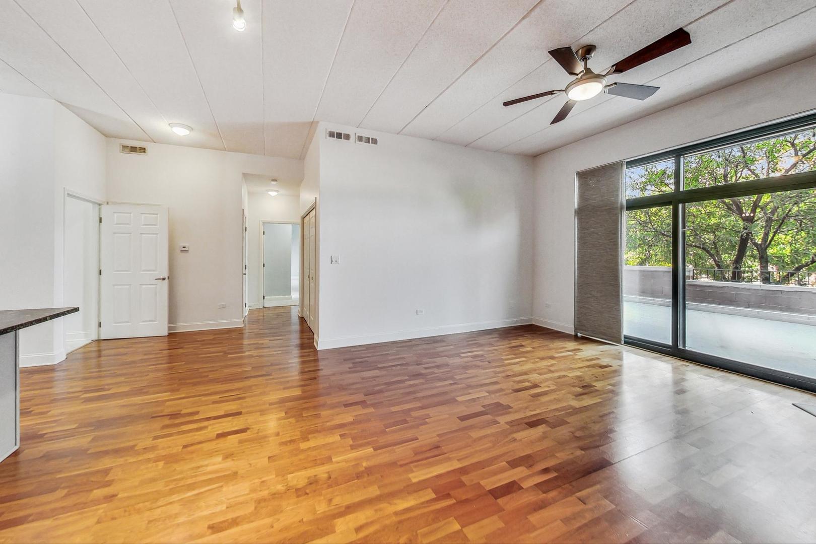 1301 West Washington Boulevard, Unit 208 Chicago, IL 60607 - Photo 8 of 37 a view of an empty room with a window