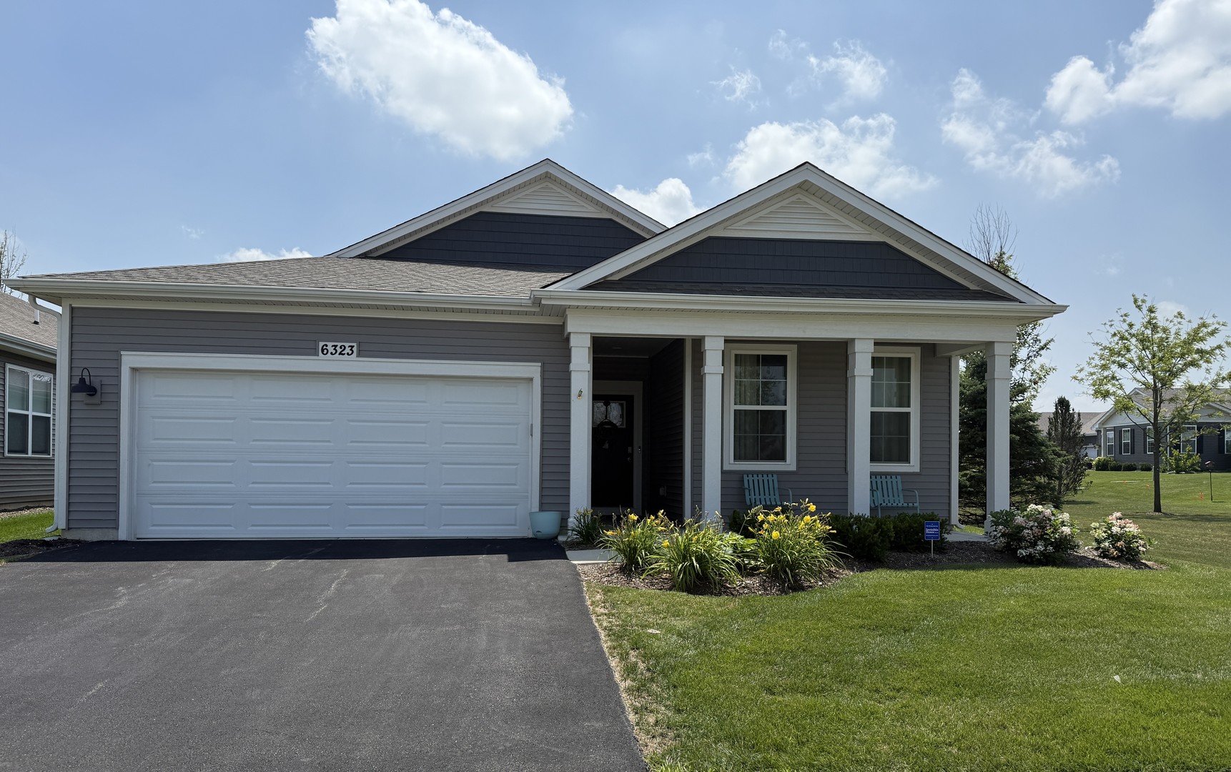6323 Aspen Lane Wonder Lake, IL 60097 - Photo 1 of 17 a front view of a house with a yard and garage