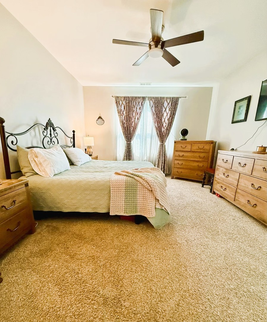 6323 Aspen Lane Wonder Lake, IL 60097 - Photo 10 of 17 a bedroom with a bed dresser and window