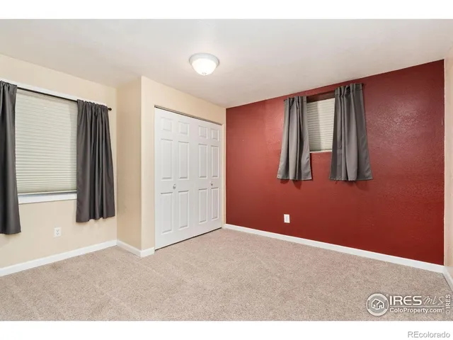 a view of a livingroom with an empty space and window
