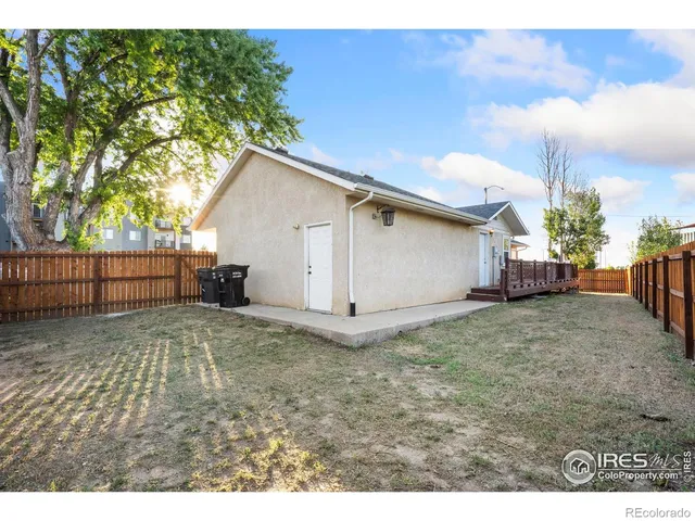 a view of a porch with a floor to ceiling window