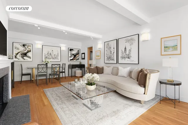 a living room with furniture a rug and a table