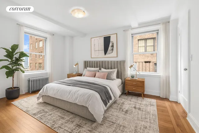 a bedroom with a large bed and a window