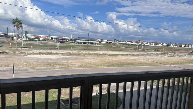 a view of a swimming pool and an outdoor seating