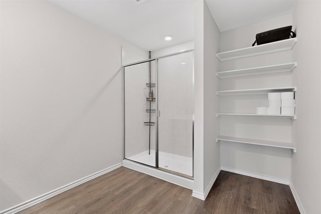 2945 Roper Street Royse City, TX 75189 - Photo 11 of 25 a view of an empty room with wooden floor