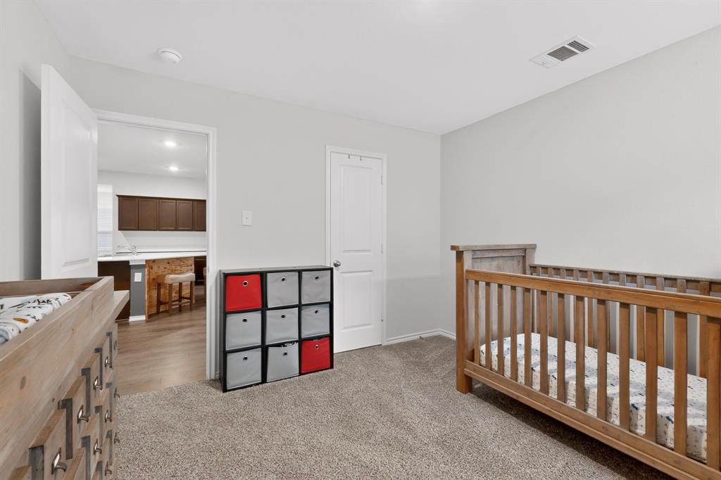 2945 Roper Street Royse City, TX 75189 - Photo 13 of 25 a view of a livingroom with furniture and flat screen tv