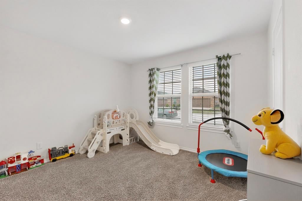 2945 Roper Street Royse City, TX 75189 - Photo 14 of 25 a view of a room with gym equipment