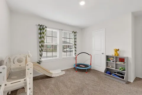 a room with a bed and a window