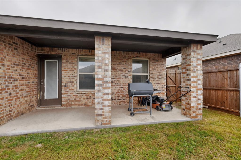 2945 Roper Street Royse City, TX 75189 - Photo 21 of 25 a view of a chairs and table in backyard of the house