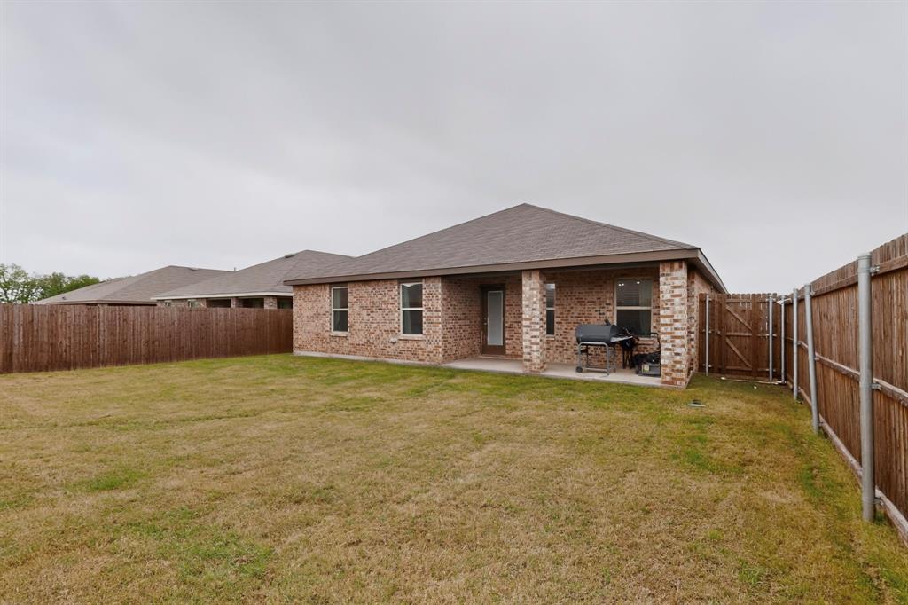 2945 Roper Street Royse City, TX 75189 - Photo 22 of 25 a view of a house with backyard and sitting area