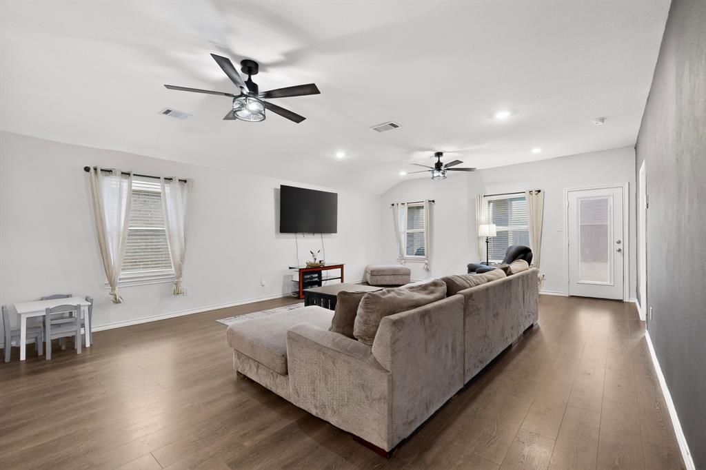 2945 Roper Street Royse City, TX 75189 - Photo 3 of 25 a living room with furniture and a flat screen tv