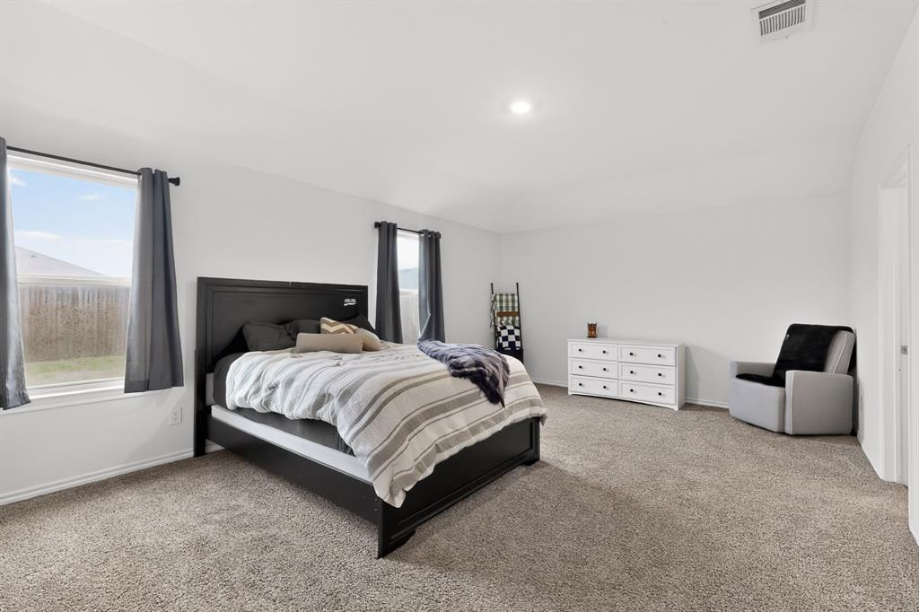 2945 Roper Street Royse City, TX 75189 - Photo 8 of 25 a spacious bedroom with a bed and window