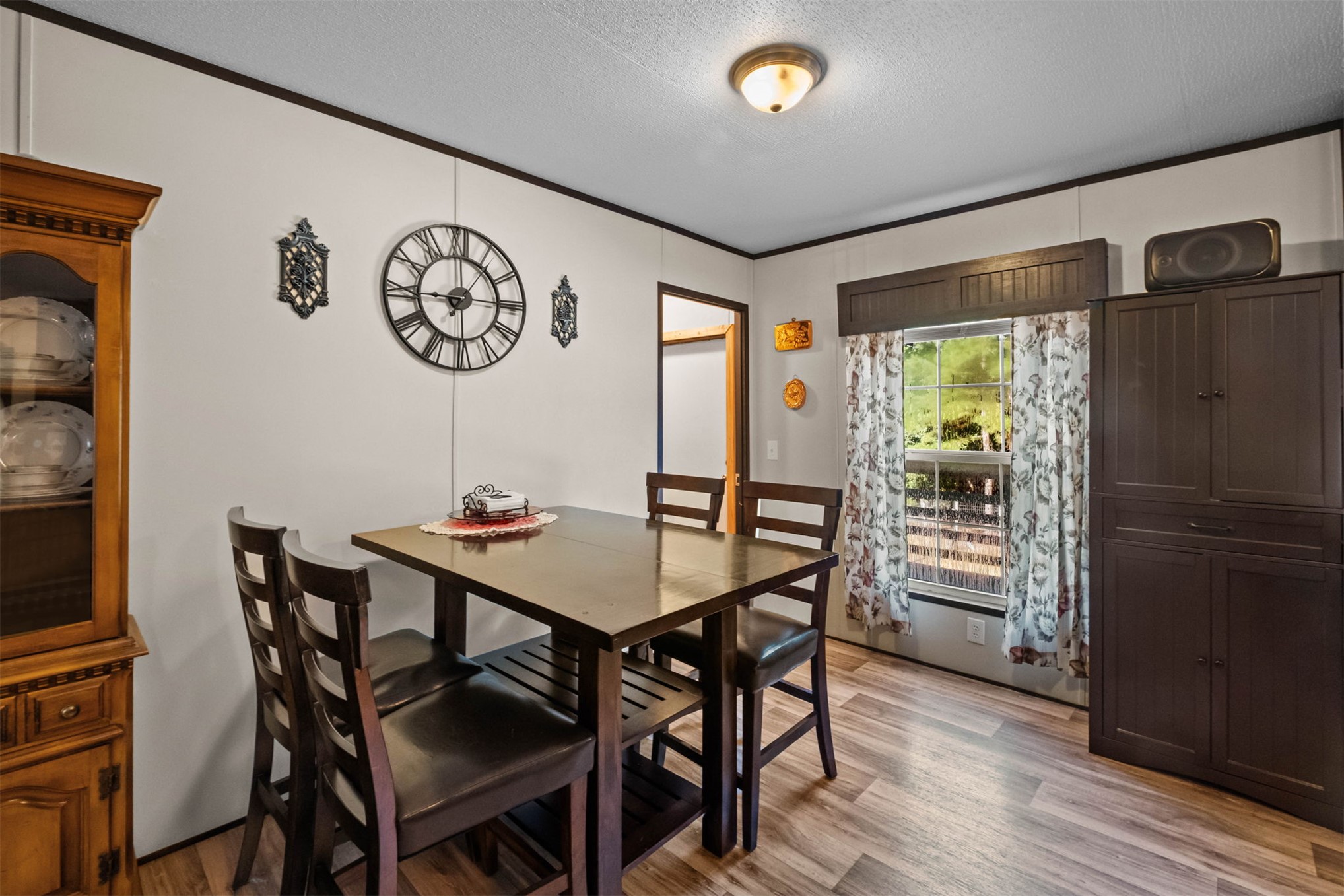 57443 667th Colcord, OK 74338 - Photo 18 of 51 Wood-finish flooring with a neutral wall color and dark trim