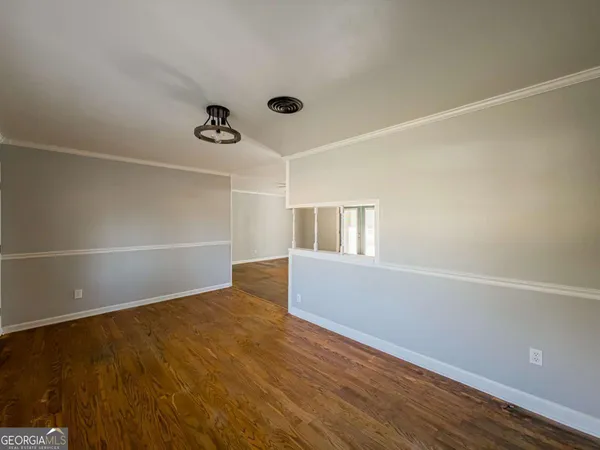 a view of small space with wooden floor