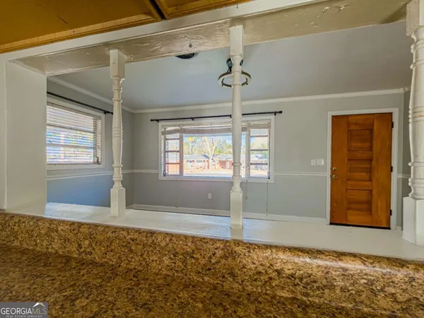 a view of an empty room with a window