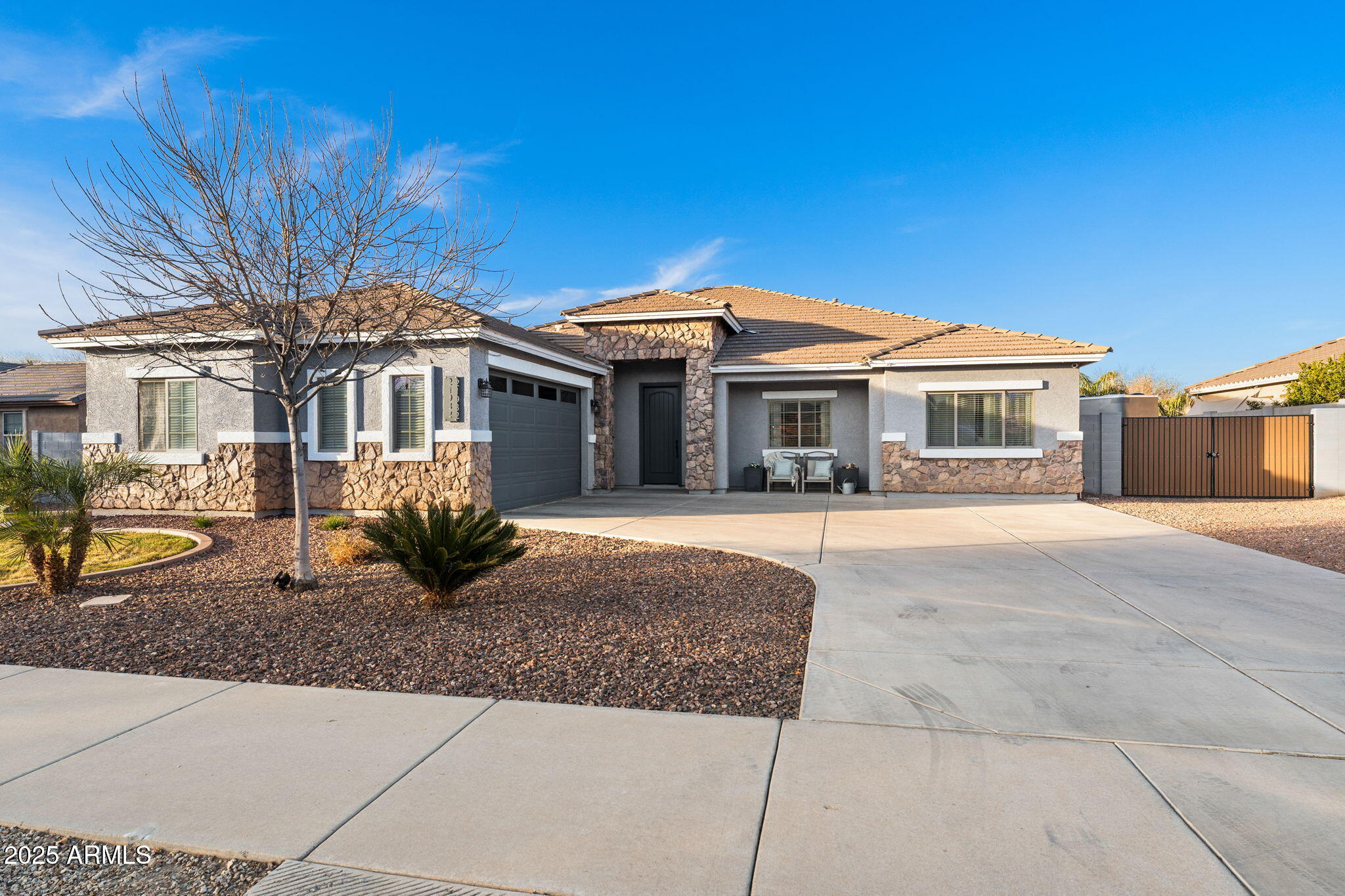 21932 East Rosa Road Queen Creek, AZ 85142 - Photo 1 of 19 a front view of a house with a porch