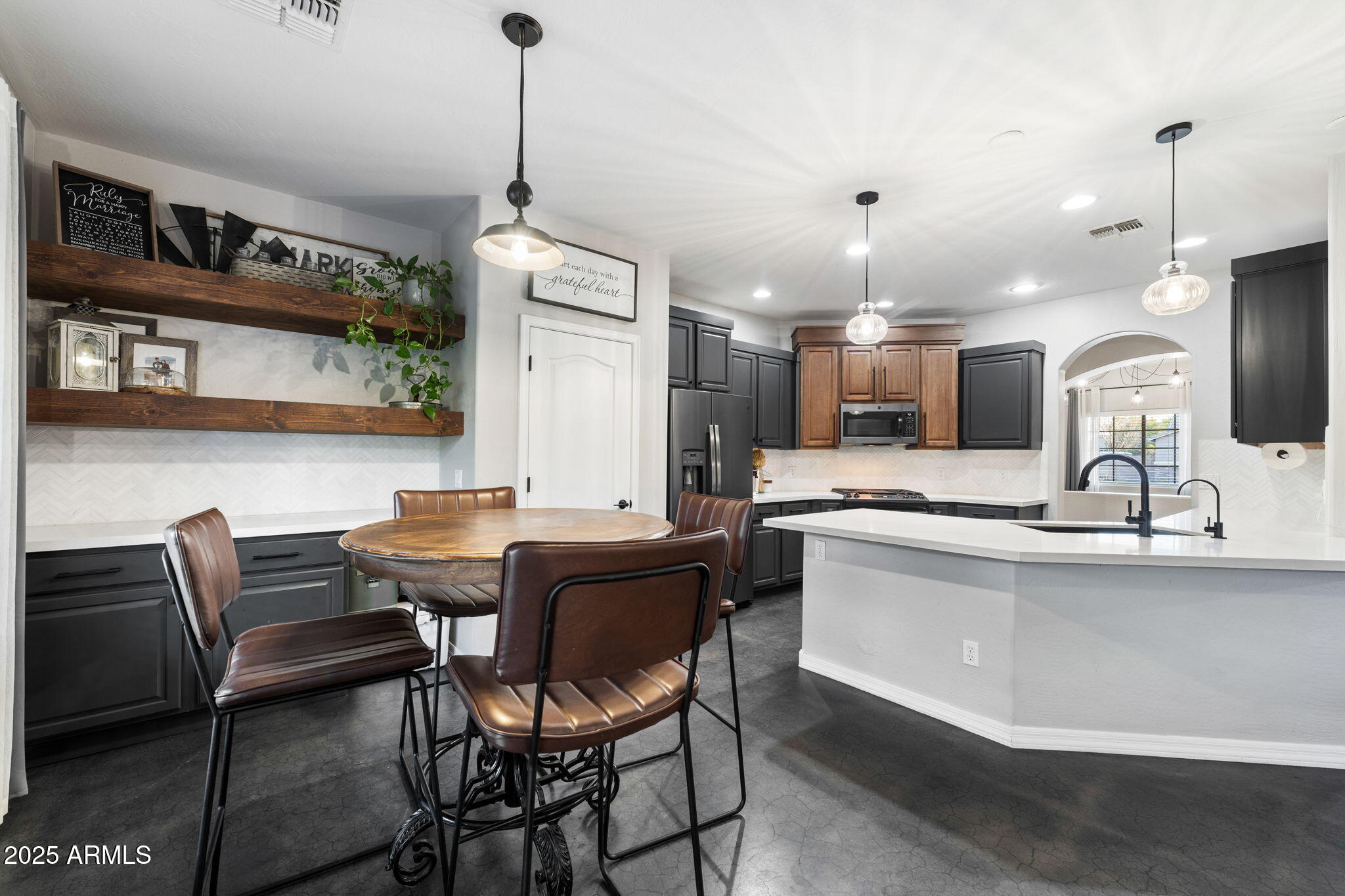 21932 East Rosa Road Queen Creek, AZ 85142 - Photo 2 of 19 a kitchen with a table and chairs in it