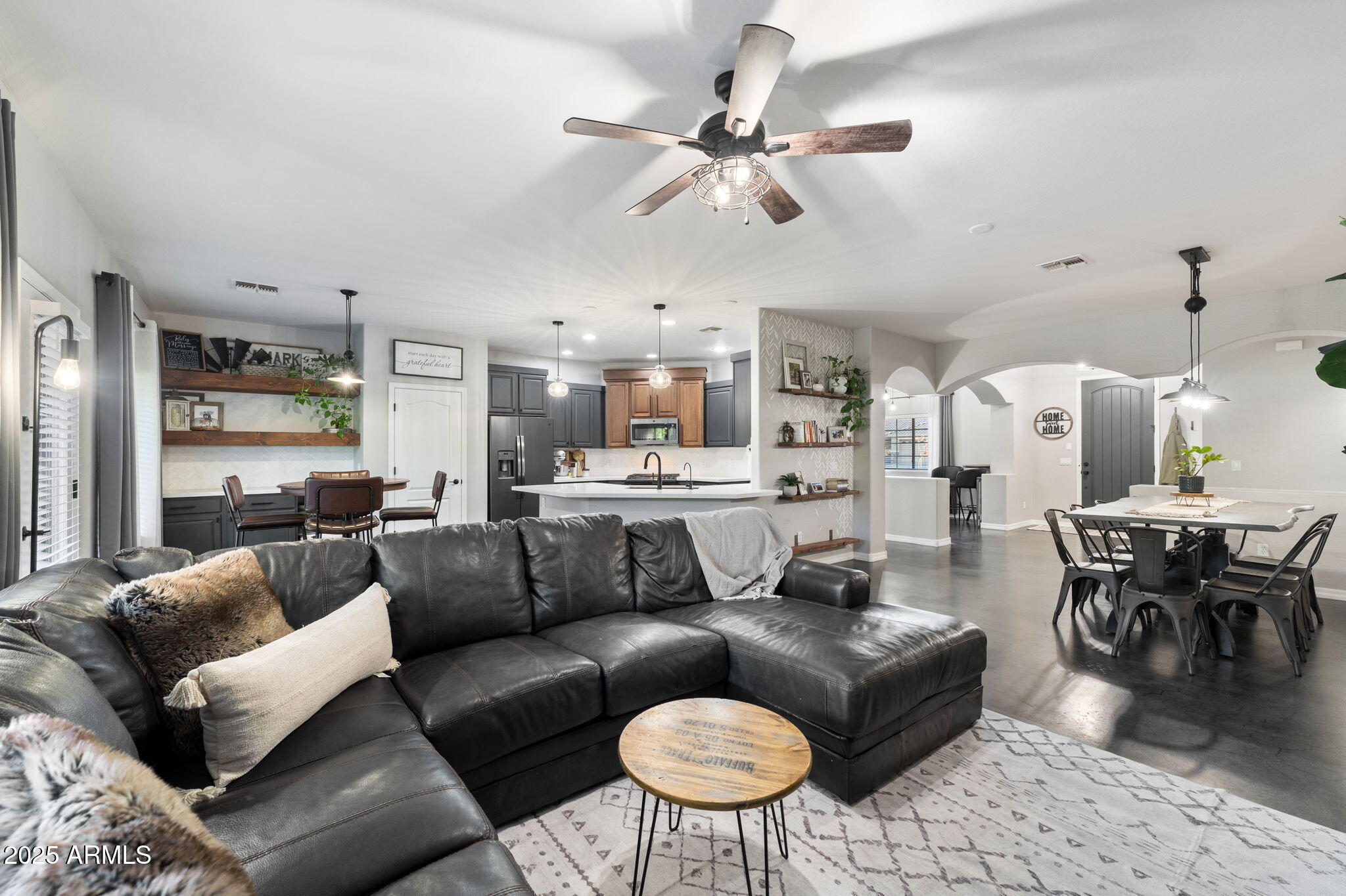 21932 East Rosa Road Queen Creek, AZ 85142 - Photo 5 of 19 a living room with furniture kitchen view and a chandelier