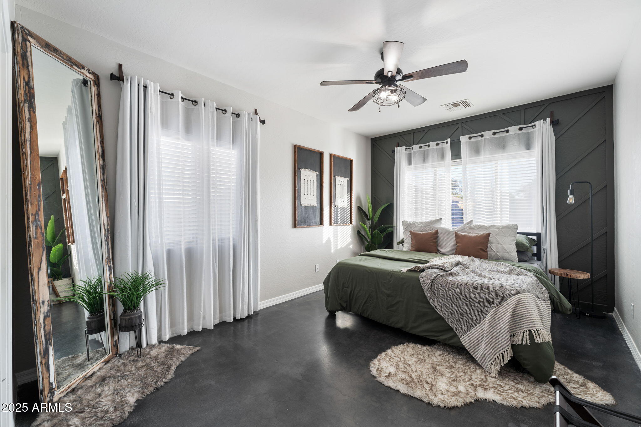 21932 East Rosa Road Queen Creek, AZ 85142 - Photo 9 of 19 a bedroom with a large bed and a chandelier