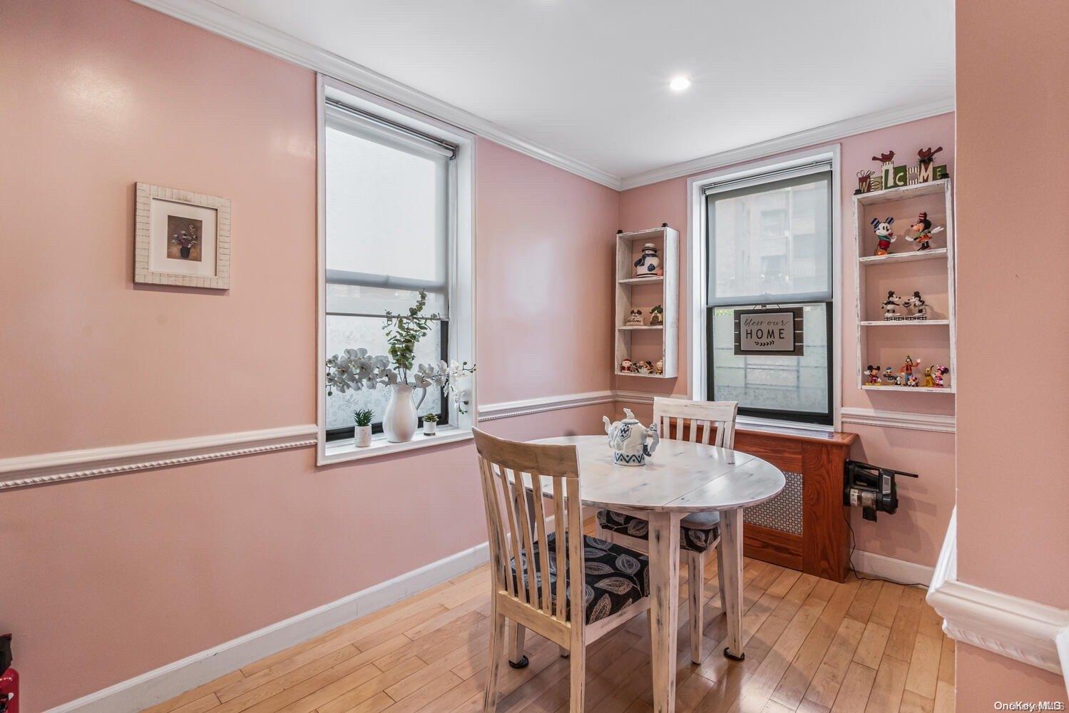 84-19 51st Avenue, Unit 1P Queens, NY 11373 - Photo 11 of 18 a dining room with furniture and window
