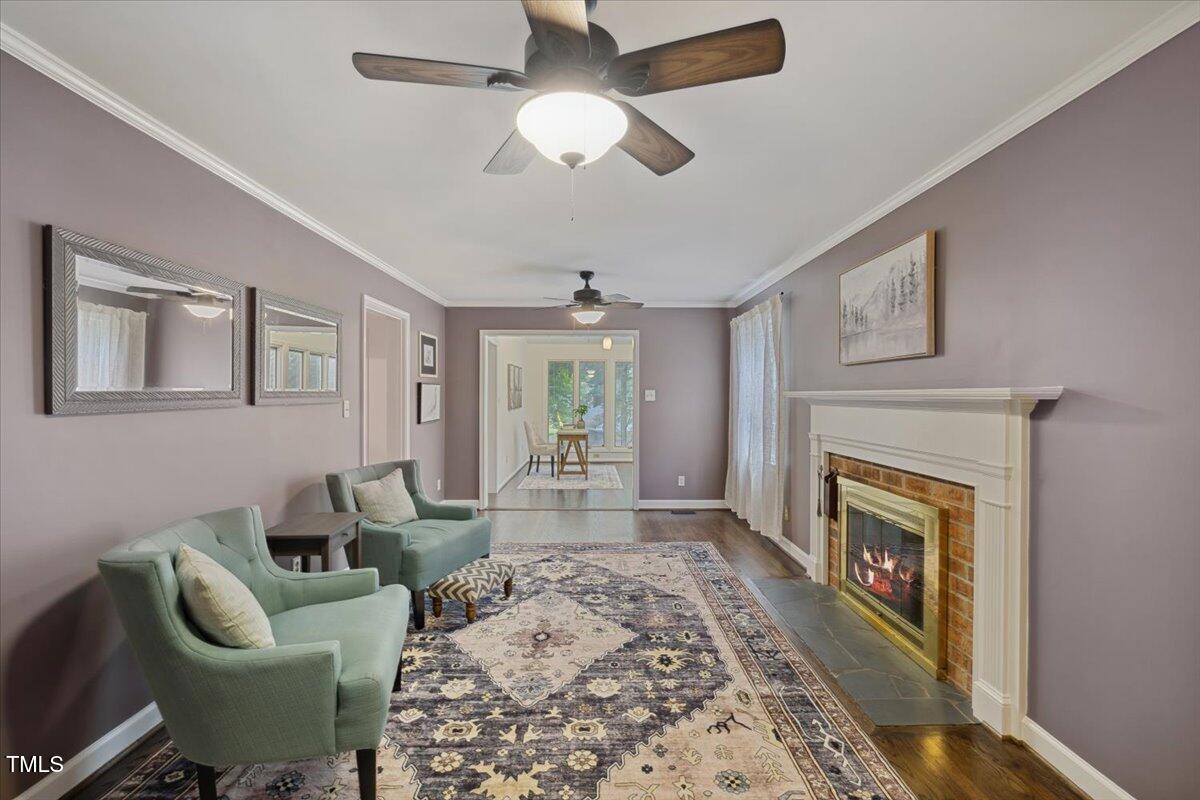 3317 Harden Road Raleigh, NC 27607 - Photo 11 of 53 a living room with furniture and a fireplace