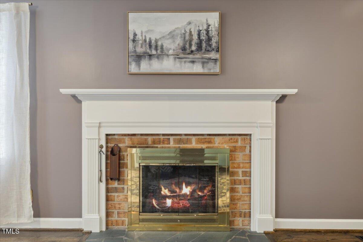 3317 Harden Road Raleigh, NC 27607 - Photo 12 of 53 a living room with a fireplace