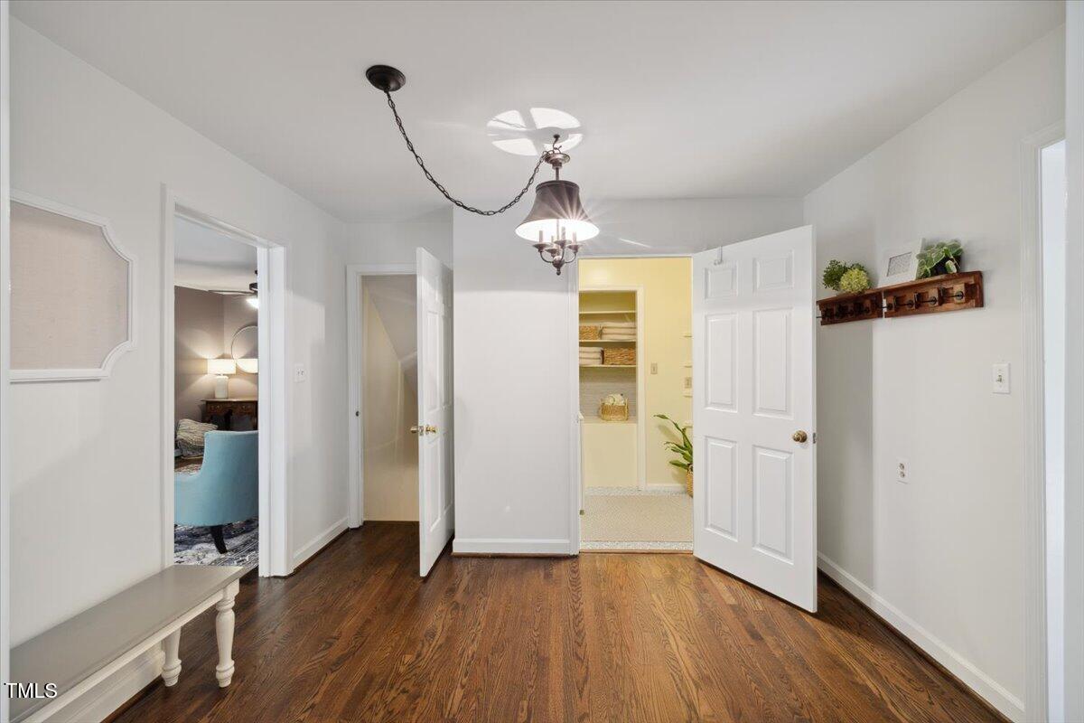 3317 Harden Road Raleigh, NC 27607 - Photo 17 of 53 a view of a room with wooden floor closet and windows