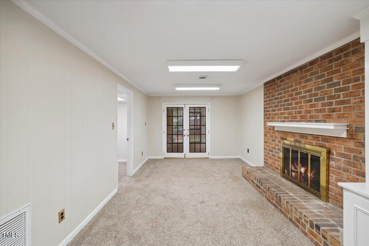 3317 Harden Road Raleigh, NC 27607 - Photo 40 of 53 a view of empty room with a fireplace