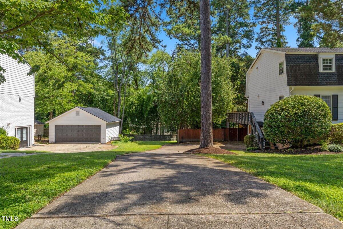 3317 Harden Road Raleigh, NC 27607 - Photo 4 of 53 a front view of a house with a yard and trees