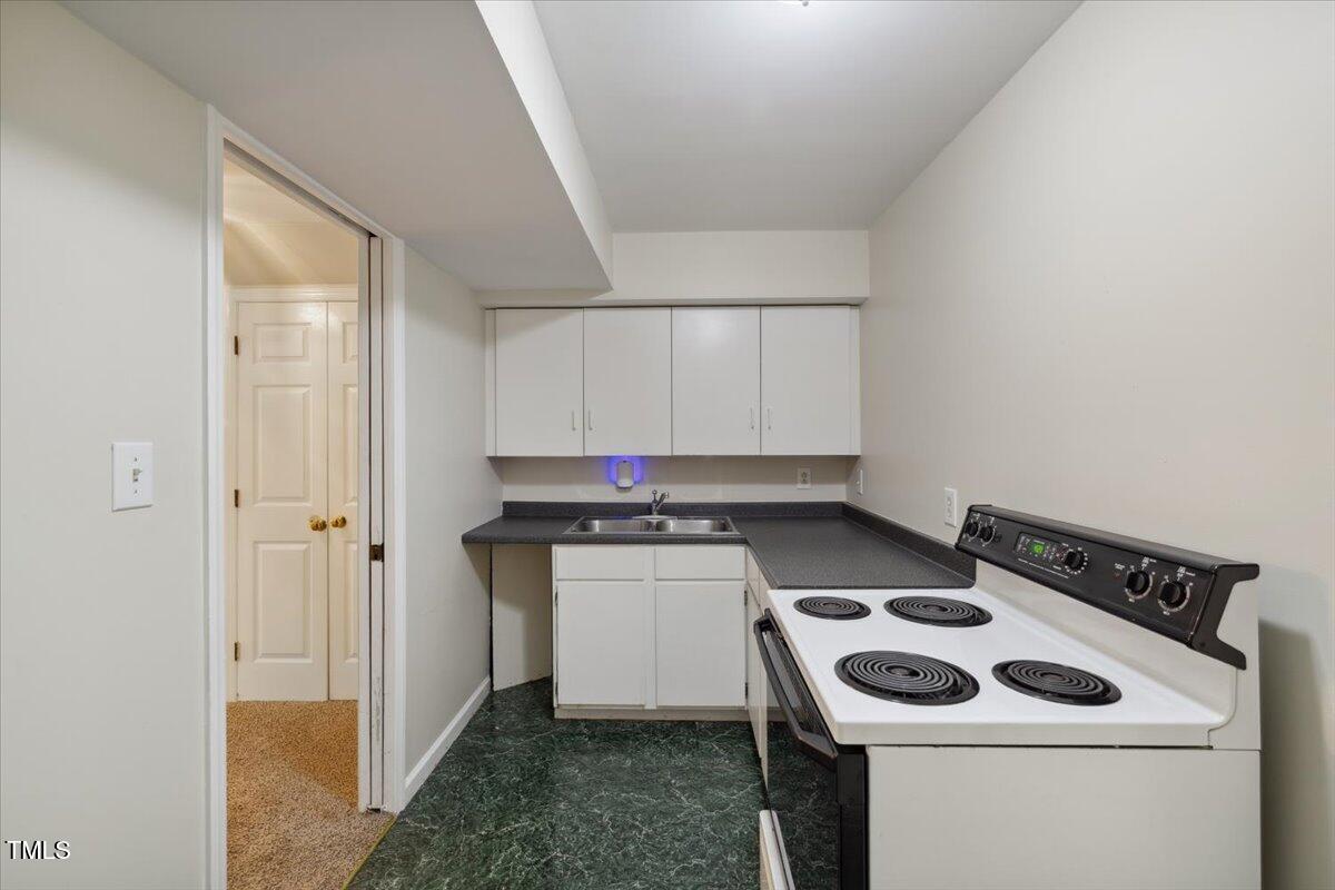 3317 Harden Road Raleigh, NC 27607 - Photo 47 of 53 a kitchen with a stove and a microwave