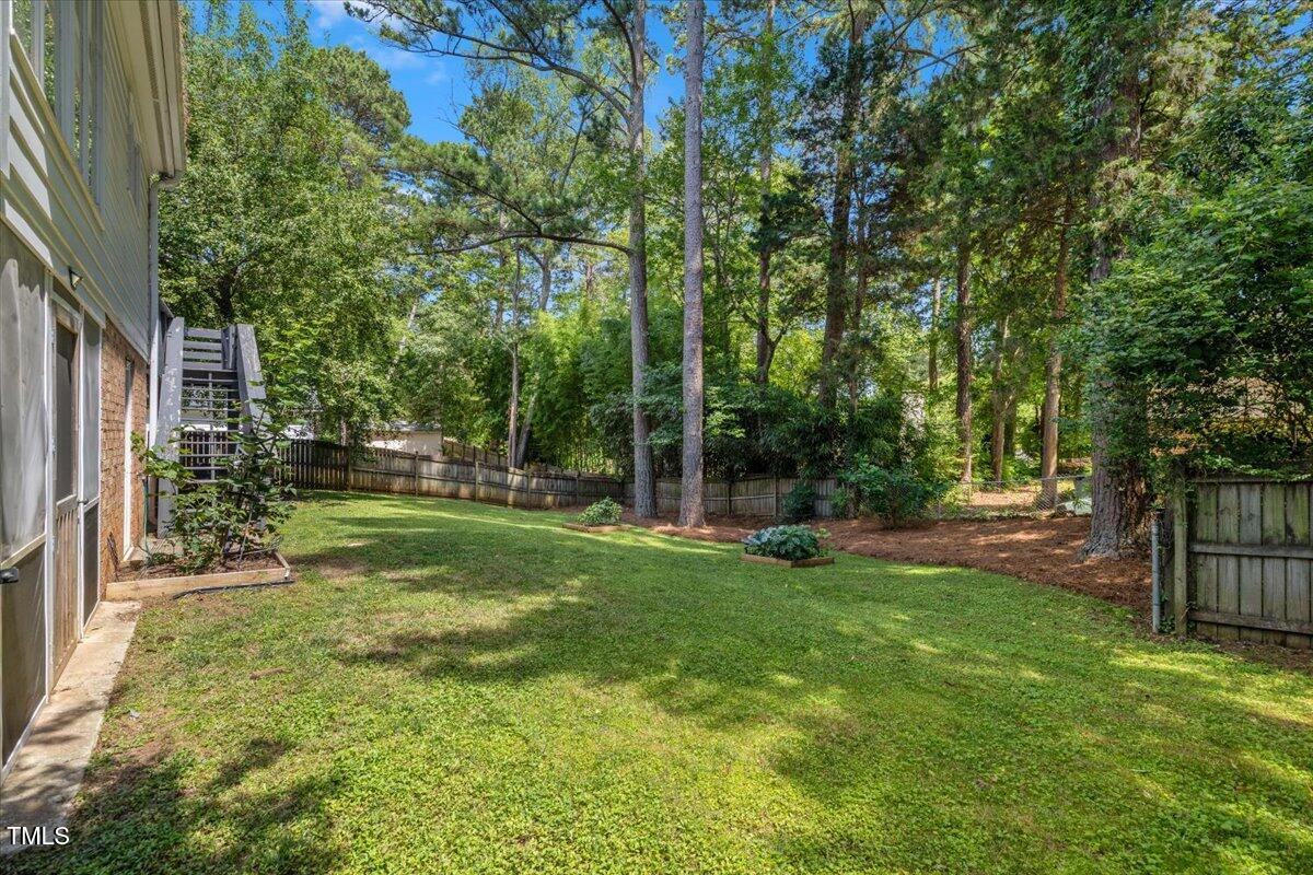 3317 Harden Road Raleigh, NC 27607 - Photo 51 of 53 a view of a backyard with large trees