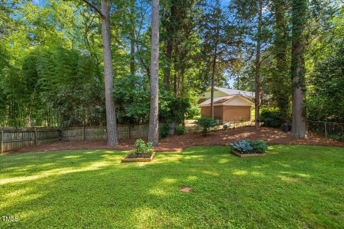 3317 Harden Road Raleigh, NC 27607 - Photo 6 of 53 a swimming pool with outdoor seating and yard