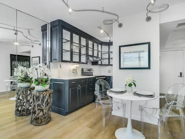 a kitchen with a table and chairs