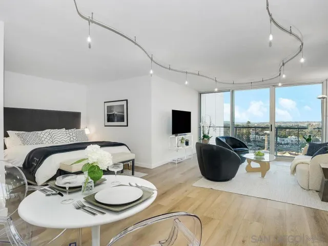 a bedroom with a bed and a table