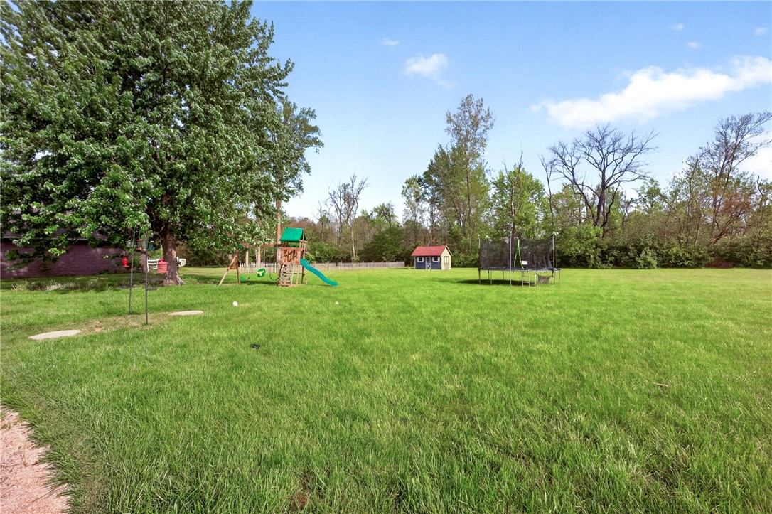 4996 Shannon Avenue Springfield, OH 45504 - Photo 54 of 61 This expansive green yard offers ample space for various outdoor activities and entertainment.