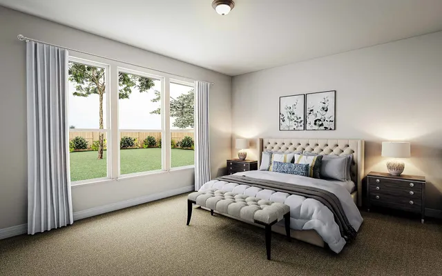 a bedroom with a bed and a large window