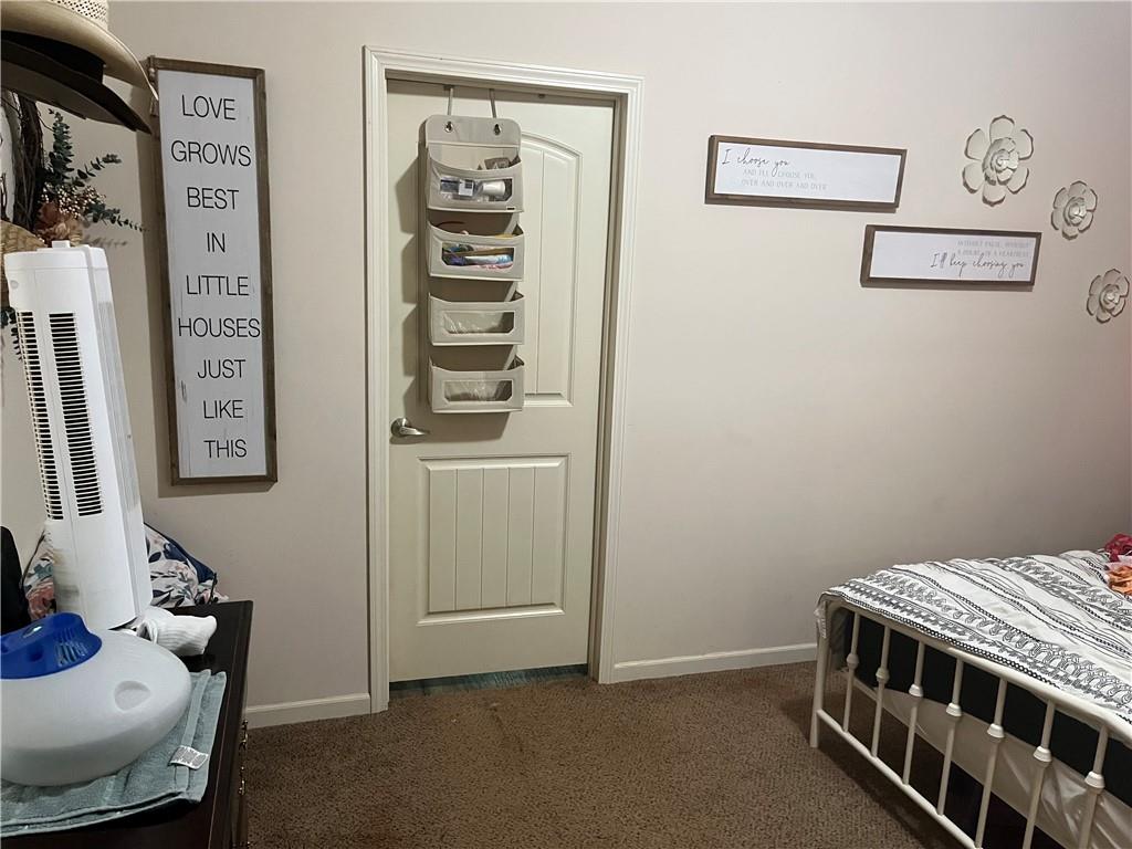 2477 Shoal Creek Road Colbert, GA 30628 - Photo 11 of 19 a bedroom with a bed and a desk