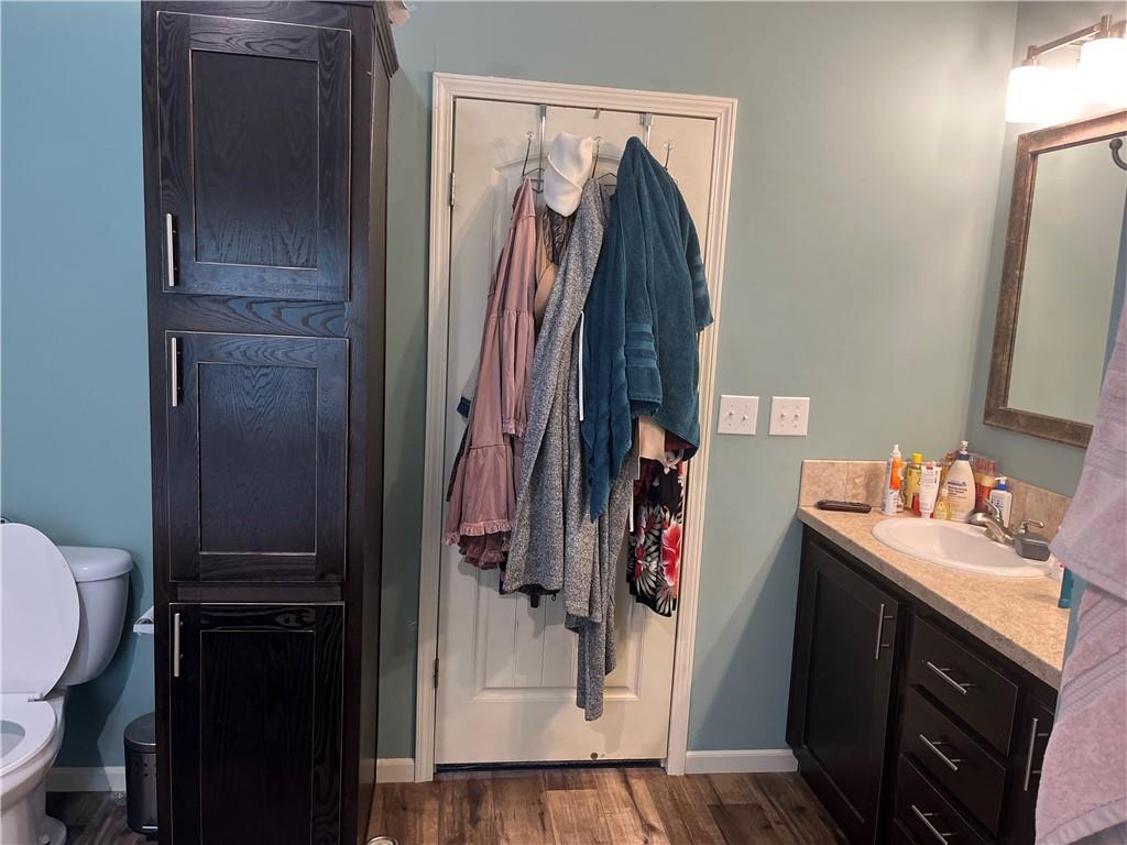 2477 Shoal Creek Road Colbert, GA 30628 - Photo 13 of 19 a view of walk in closet with clothes and shoes