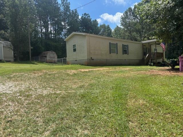 2477 Shoal Creek Road Colbert, GA 30628 - Photo 15 of 19 a house view with a garden space