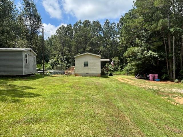 2477 Shoal Creek Road Colbert, GA 30628 - Photo 16 of 19 a house view with a garden space