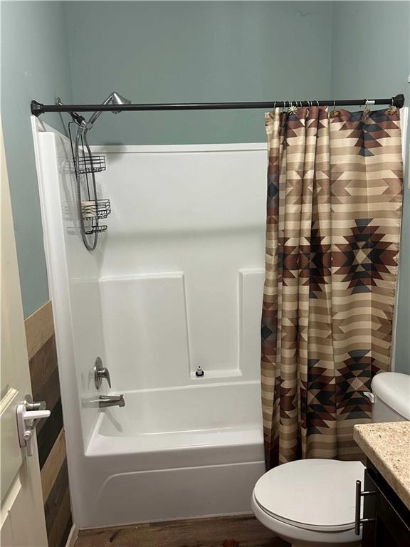 2477 Shoal Creek Road Colbert, GA 30628 - Photo 5 of 19 a bathroom with a shower curtain and a sink