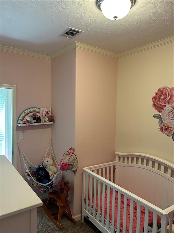 2477 Shoal Creek Road Colbert, GA 30628 - Photo 7 of 19 a view of a room with baby toys