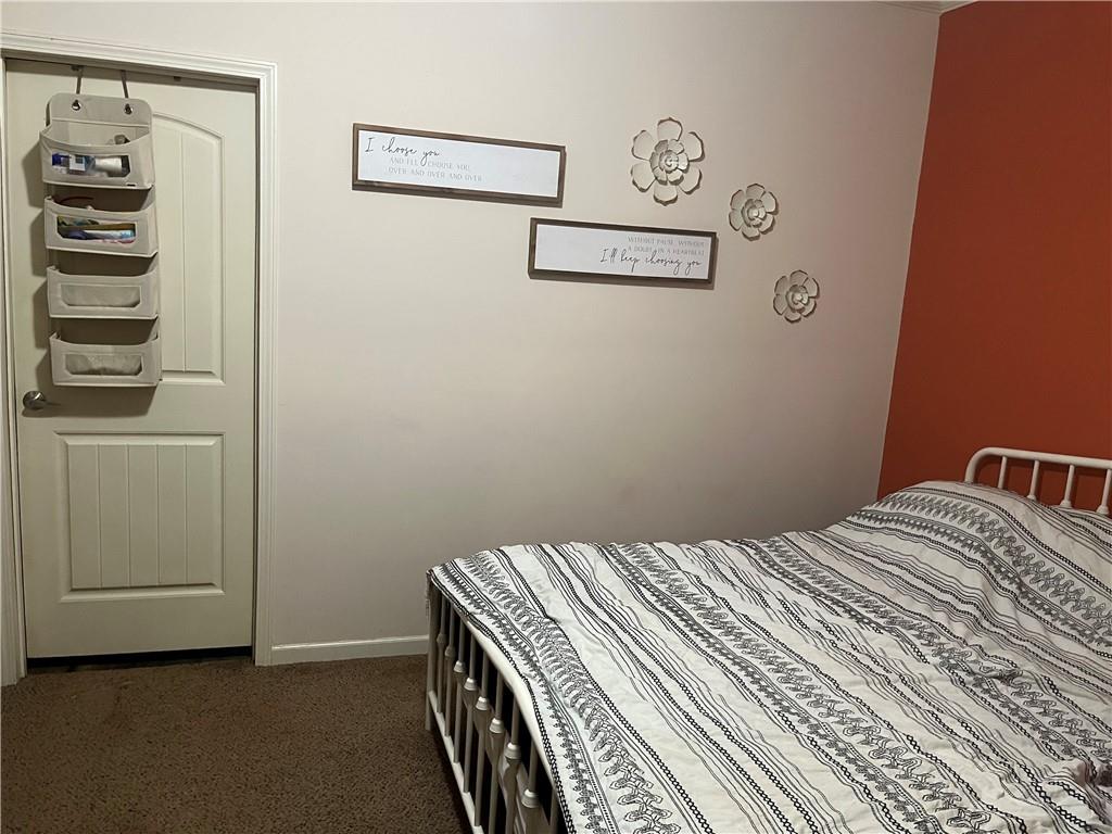 2477 Shoal Creek Road Colbert, GA 30628 - Photo 10 of 19 a bedroom with a bed and a cabinets