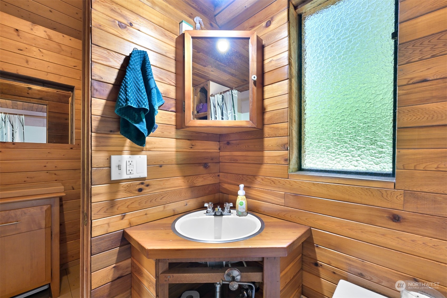 2125 Butler Creek Road Sedro-Woolley, WA 98284 - Photo 16 of 40 a bathroom with a sink and a mirror