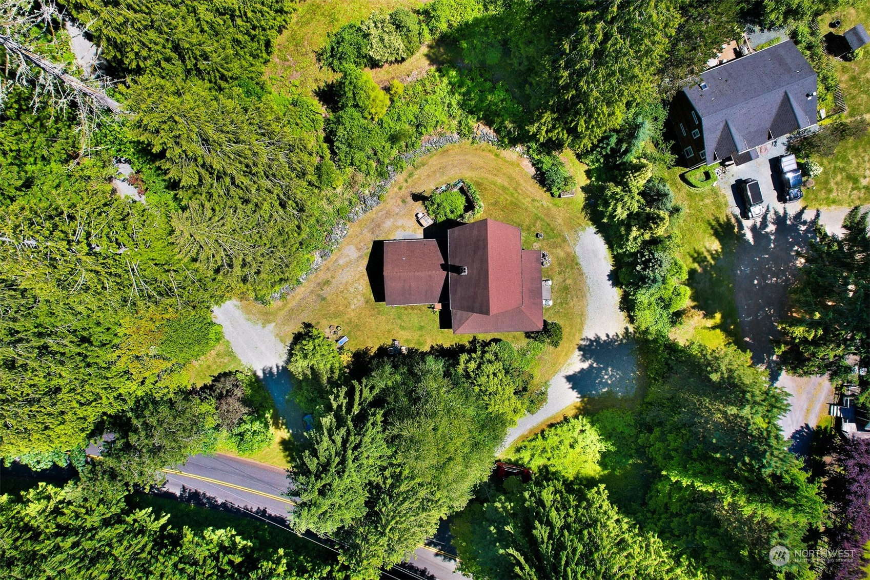 2125 Butler Creek Road Sedro-Woolley, WA 98284 - Photo 2 of 40 an aerial view of a house with a yard and garden